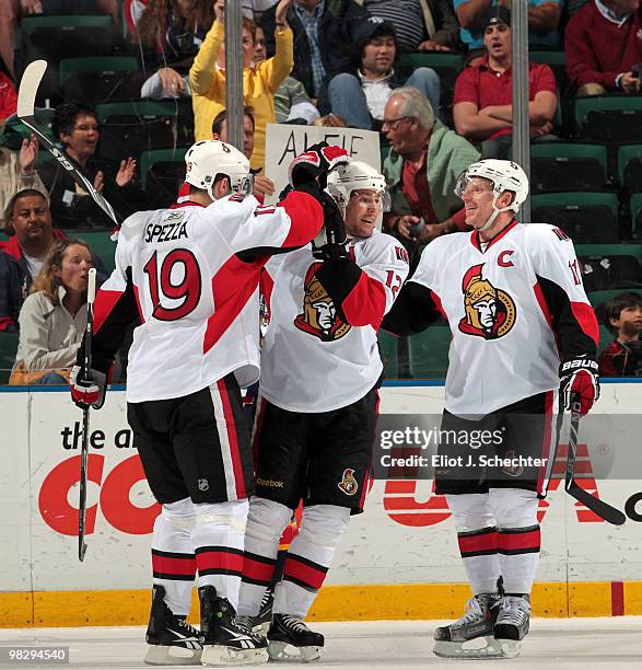 Mike Fisher of the Ottawa Senators celebrates his goal with teammates Jason Spezza and Daniel Alfredsson against the Florida Panthers at the...