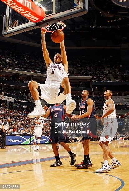 Tyson Chandler of the Charlotte Bobcats dunks against Al Horford of the Atlanta Hawks on April 6, 2010 at the Time Warner Cable Arena in Charlotte,...