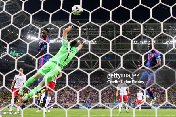 Yerry Mina of Colombia scores his team's first goal past Wojciech Szczesny of Poland during the 2018 FIFA World Cup Russia group H match between...