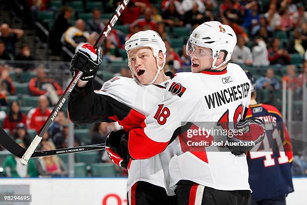 Chris Neil is congratulated by Jesse Winchester of the Ottawa Senators after scoring a goal against the Florida Panthers on April 6, 2010 at the...