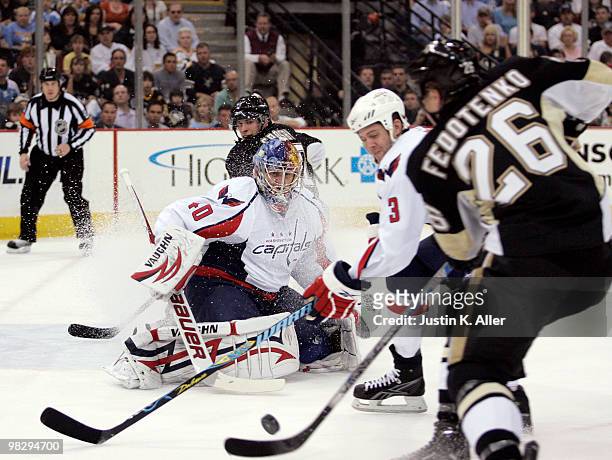 Semyon Varlamov of the Washington Capitals makes a save on the shot of Ruslan Fedotenko of the Pittsburgh Penguins in the first period at Mellon...