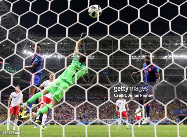Yerry Mina of Colombia scores his team's first goal past Wojciech Szczesny of Poland during the 2018 FIFA World Cup Russia group H match between...