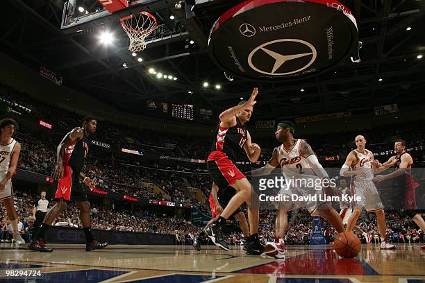 Mo Williams of the Cleveland Cavaliers pushes the ball into the paint against Rasho Nesterovic of the Toronto Raptors on April 6, 2010 at The Quicken...