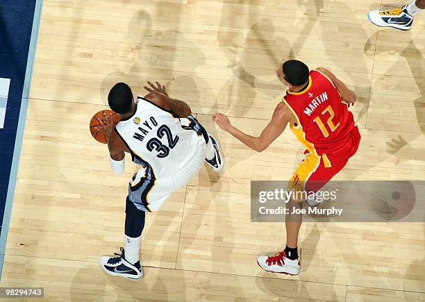 Mayo of the Memphis Grizzlies looks to pass around Kevin Martin of the Houston Rockets on April 6, 2010 at FedExForum in Memphis, Tennessee. NOTE TO...