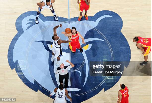 Hasheem Thabeet of the Memphis Grizzlies jumps against Luis Scola of the Houston Rockets on April 6, 2010 at FedExForum in Memphis, Tennessee. NOTE...