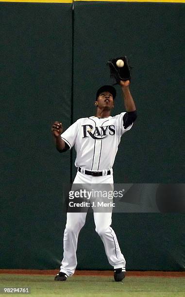Outfielder B.J. Upton of the Tampa Bay Rays catches a fly ball against the Baltimore Orioles during the home opener game at Tropicana Field on April...