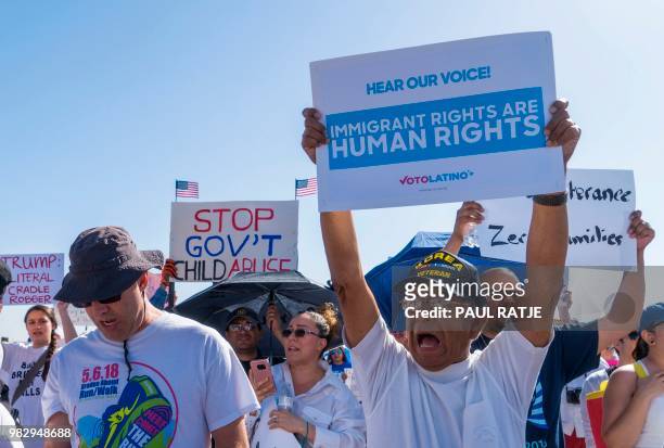 Activists shout chants during the "End Family Detention," event held at the Tornillo Port of Entry in Tornillo, Texas on June 24, 2018. - Texas is at...