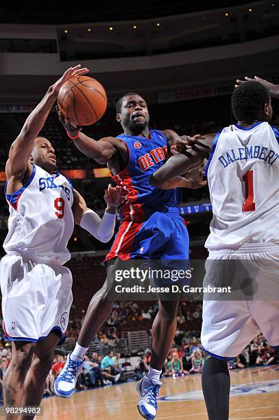 Will Bynum of the Detroit Pistons shoots against Andre Iguodala and Samuel Dalembert of the Philadelphia 76ers during the game on April 6, 2010 at...