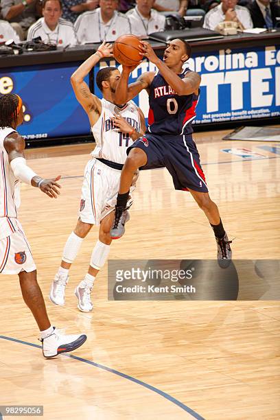 Augustin of the Charlotte Bobcats blocks against Jeff Teague of the Atlanta Hawks on April 6, 2010 at the Time Warner Cable Arena in Charlotte, North...