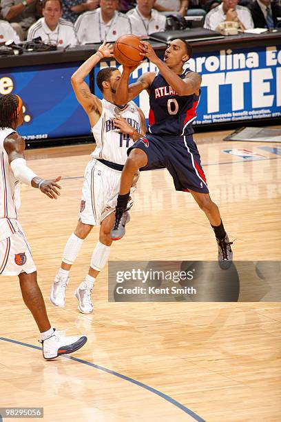 Augustin of the Charlotte Bobcats blocks against Jeff Teague of the Atlanta Hawks on April 6, 2010 at the Time Warner Cable Arena in Charlotte, North...