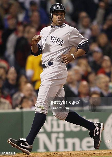 Curtis Granderson of the New York Yankees scores a run in the fifth inning against the Boston Red Sox on April 6, 2010 at Fenway Park in Boston,...