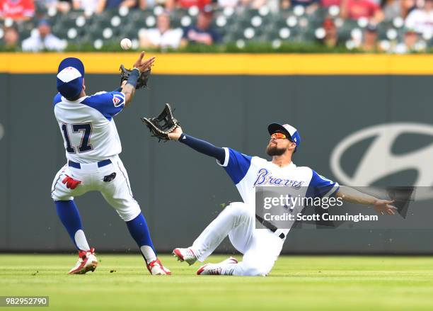 Ender Inciarte of the Atlanta Braves makes a sliding catch as Johan Camargo closes in during the first inning against the Baltimore Orioles at...