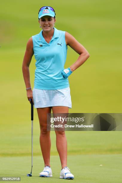 Lexi Thompson stands on the green of the fourth hole during the final round of the Walmart NW Arkansas Championship Presented by P&G at Pinnacle...