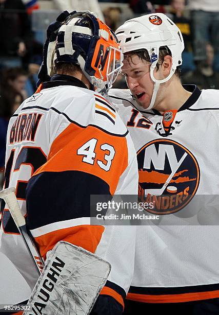 Josh Bailey and Martin Biron of the New York Islanders celebrate against the Philadelphia Flyers on April 1, 2010 at Nassau Coliseum in Uniondale,...