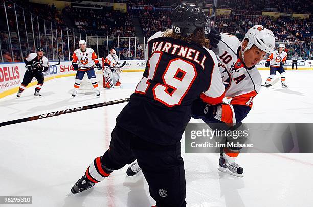 Scott Hartnell of the Philadelphia Flyers skates against Richard Park of the New York Islanders on April 1, 2010 at Nassau Coliseum in Uniondale, New...