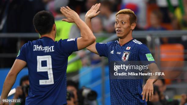 Keisuke Honda of Japan celebrates with team mate Shinji Okasaki after equalising during the 2018 FIFA World Cup Russia group H match between Japan...