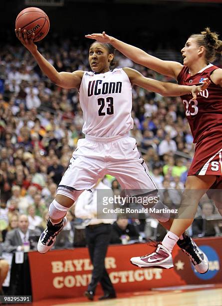 Forward Maya Moore of the Connecticut Huskies takes a shot against Jeanette Pohlen of the Stanford Cardinal during the NCAA Women's Final Four...