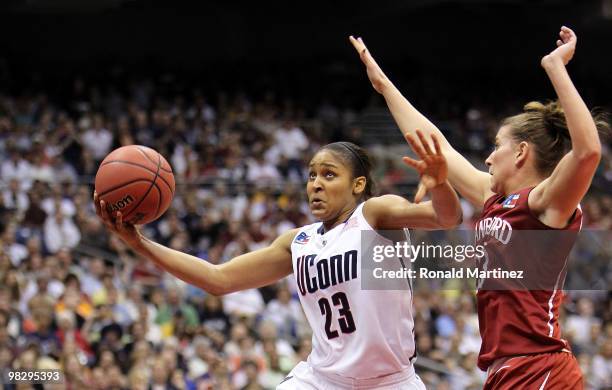 Forward Maya Moore of the Connecticut Huskies takes a shot against Jeanette Pohlen of the Stanford Cardinal during the NCAA Women's Final Four...