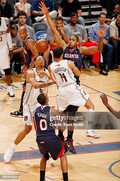 Augustin of the Charlotte Bobcats guards against the Atlanta Hawks on April 6, 2010 at the Time Warner Cable Arena in Charlotte, North Carolina. NOTE...