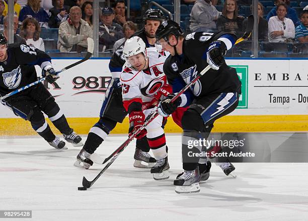 Steven Stamkos of the Tampa Bay Lightning tries to block the pass of Ray Whitney of the Carolina Hurricanes at the St. Pete Times Forum on April 6,...