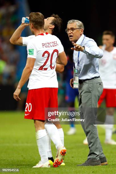 Adam Nawalka, Head coach of Poland speaks to Lukasz Piszczek of Poland during the 2018 FIFA World Cup Russia group H match between Poland and...