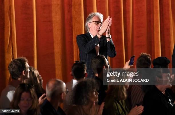 British fashion designer Paul Smith acknowledges the audience at the end of his Paul-Smith presentation during the men's Spring/Summer 2019 fashion...
