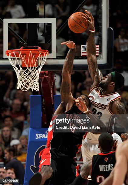 LeBron James of the Cleveland Cavaliers goes up for the alley oop pass defended by Amir Johnson of the Toronto Raptors on April 6, 2010 at The...