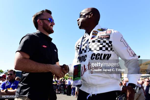 Austin Dillon, driver of the Dow Chevrolet, and MC Hammer attend the driver's meeting prior to the Monster Energy NASCAR Cup Series Toyota/Save Mart...