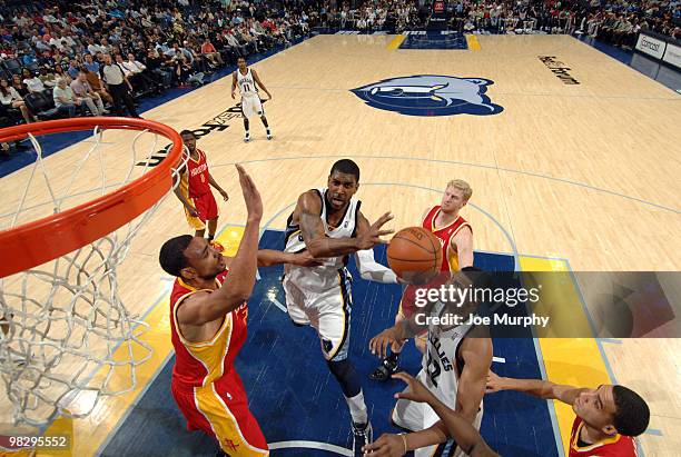 Mayo of the Memphis Grizzlies shoots around Jared Jeffries of the Houston Rockets on April 06, 2010 at FedExForum in Memphis, Tennessee. NOTE TO...