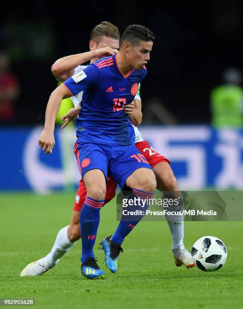 Lukasz Piszczek of Poland competes with James Rodriguez of Colombia during the 2018 FIFA World Cup Russia group H match between Poland and Colombia...