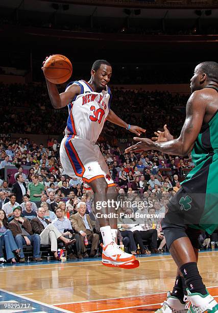 Earl Barron of the New York Knicks saves the ball from going out of bounds in NBA action against the Boston Celtics on April 6, 2010 at Madison...