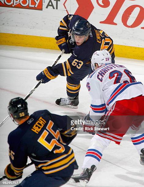 Tyler Ennis of the Buffalo Sabres looks to make a pass to Jochen Hecht as Erik Christensen of the New York Rangers defends at HSBC Arena on April 6,...