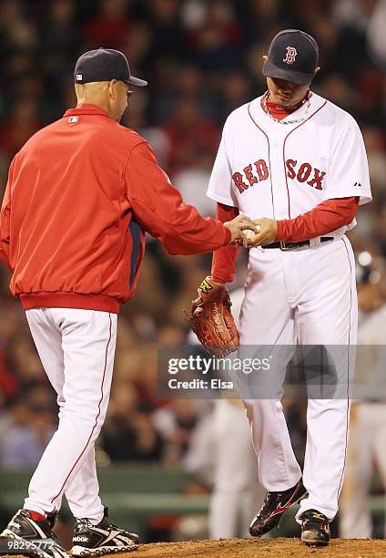 Manager Terry Francona of the Boston Red Sox pull Hideki Okajima after he walked Nick Johnson of the New York Yankees with the bases loaded on April...
