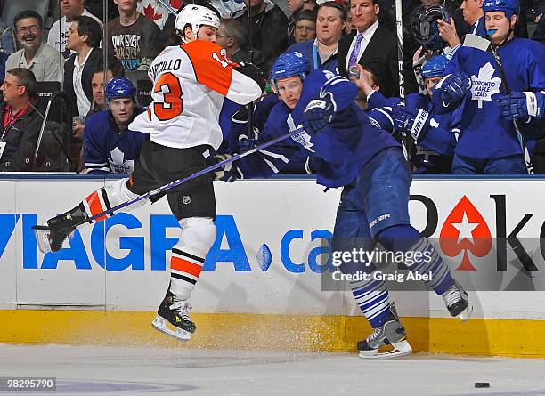 Luke Schenn of the Toronto Maple Leafs checks Daniel Carcillo of the Philadelphia Flyers during game action April 6, 2010 at the Air Canada Centre in...