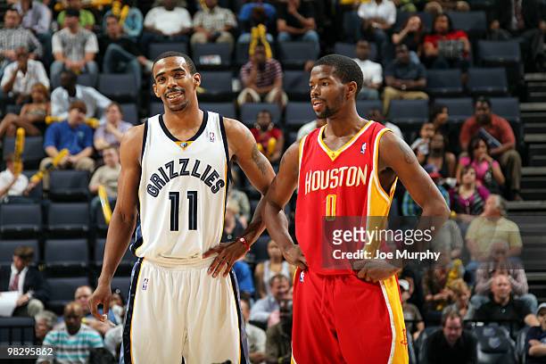 Mike Conley of the Memphis Grizzlies talks with Aaron Brooks of the Houston Rockets on April 06, 2010 at FedExForum in Memphis, Tennessee. NOTE TO...