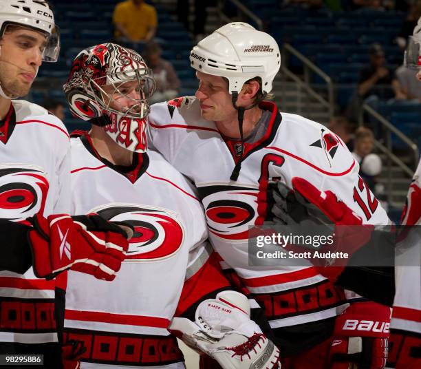 Eric Staal of the Carolina Hurricanes celebrates a win with teammate Cam Ward against the Tampa Bay Lightning at the St. Pete Times Forum on April 6,...