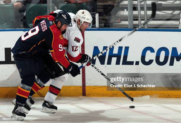 Stephen Weiss of the Florida Panthers tangles with Mike Fisher of the Ottawa Senators at the BankAtlantic Center on April 6, 2010 in Sunrise, Florida.
