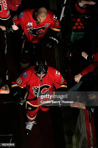 Jarome Iginla and Mikael Backlund of the Calgary Flames greet fans before stepping onto the ice for a game against the San Jose Sharks on April 6,...