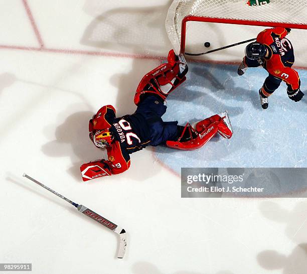 Goaltender Tomas Vokoun of the Florida Panthers butterflies on the ice after Chris Neil of the Ottawa Senators scores a goal at the BankAtlantic...