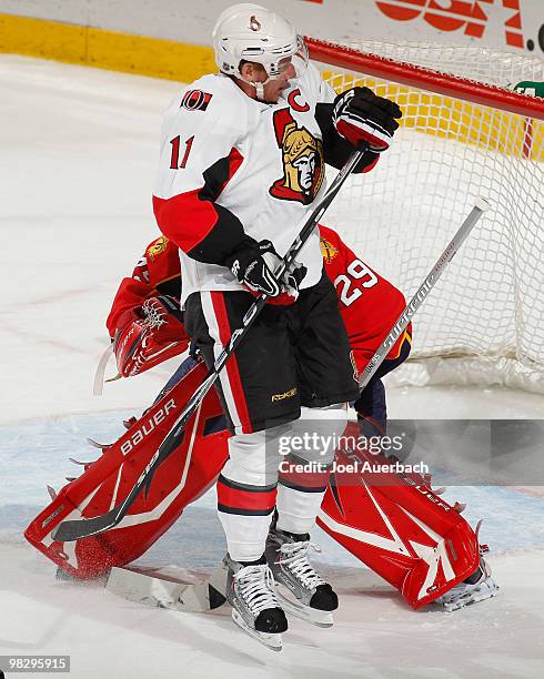 Daniel Alfredsson of the Ottawa Senators jumps up to block the view of goaltender Tomas Vokoun of the Florida Panthers on April 6, 2010 at the...