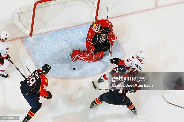 Goaltender Tomas Vokoun of the Florida Panthers stops a shot by Jesse Winchester of the Ottawa Senators on April 6, 2010 at the BankAtlantic Center...