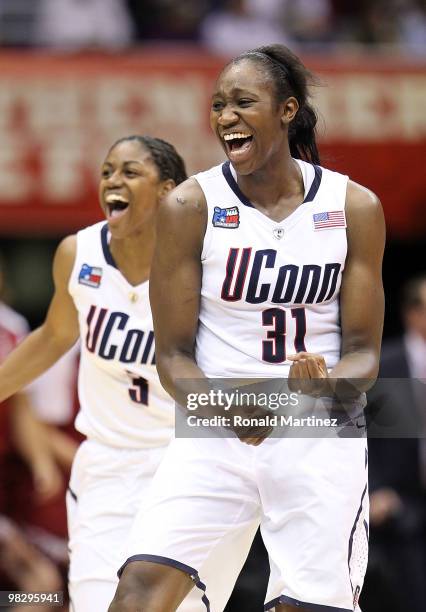 Center Tina Charles and Tiffany Hayes of the Connecticut Huskies celebrate after a 53-47 win against the Stanford Cardinal during the NCAA Women's...