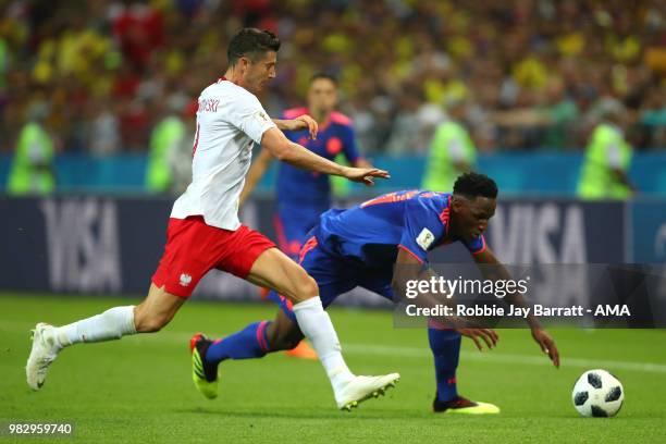 Robert Lewandowski of Poland competes with Yerry Mina of Colombia during the 2018 FIFA World Cup Russia group H match between Poland and Colombia at...