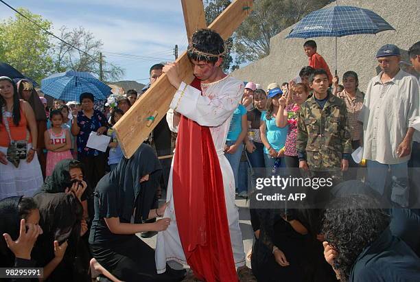 Group of Central American migrants reenact Christ's Via crucis in a shelter in Saltillo, Coahuila state, Mexico, on April 4, 2010. They are part of...