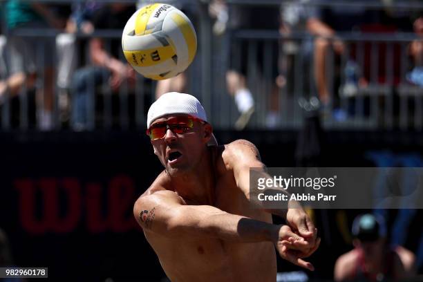 Jake Gibb pumps the ball against Jeremy Casebeer and Reid Priddy during the final rounds of the AVP Seattle Open at Lake Sammamish State Park on June...