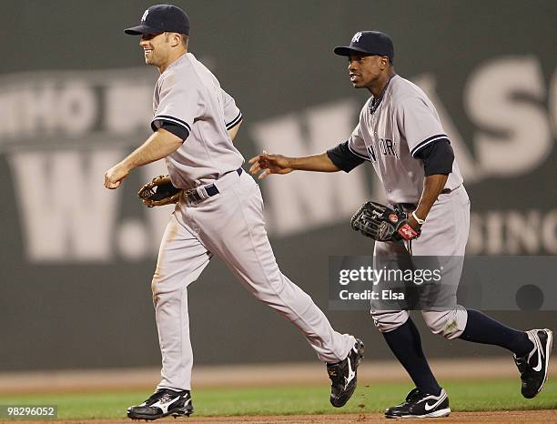 Brett Gardner and Curtis Granderson of the New York Yankees celebrate the win over the Boston Red Sox on April 6, 2010 at Fenway Park in Boston,...