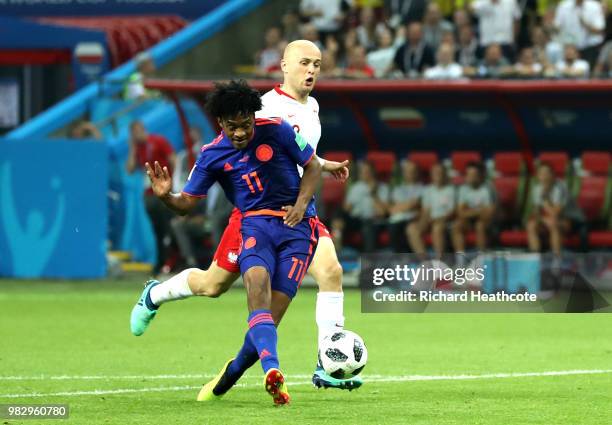 Juan Cuadrado of Colombia scores his team's third goal during the 2018 FIFA World Cup Russia group H match between Poland and Colombia at Kazan Arena...
