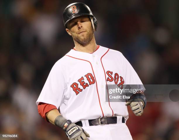 Dustin Pedroia of the Boston Red Sox reacts after he is the last out in the game against the New York Yankees on April 6, 2010 at Fenway Park in...