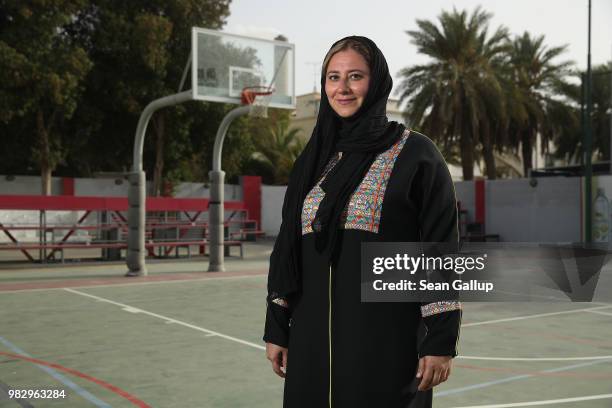 Lina Khaled Al-Maeena, a member of the 180-member Shura Council that advises Saudi King Salman bin Abdulaziz, poses for a photo as she stands on the...