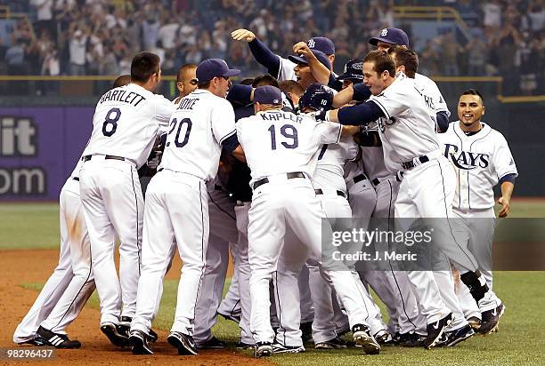 The Tampa Bay Rays celebrate their come-from-behind bottom-of-the-ninth victory over the Baltimore Orioles during the home opener game at Tropicana...